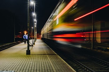 Man Walking on Train Rail