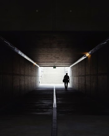 man walking on underpass