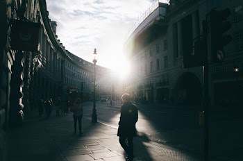 Man Walking on Walkway