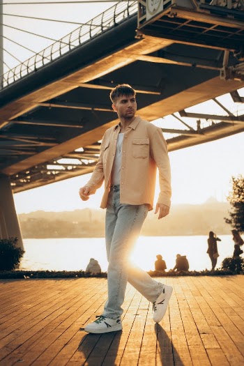 Man Walking on Wooden Dock