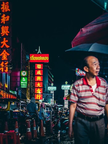 Man Walking With Umbrella