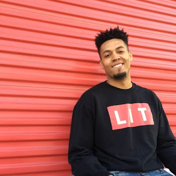Man wearing a black long-sleeved shirt smiling