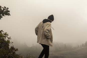 Man Wearing A White Hooded Jacket