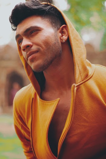 Man Wearing A Yellow Hoodie