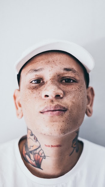Man Wearing Baseball Cap and Crew-Neck Shirt
