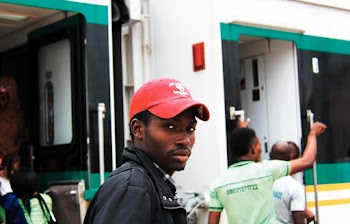 Man Wearing Baseball Cap Standing Near Train