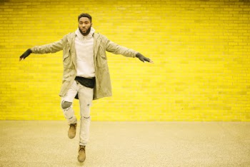 Man Wearing Beige Jacket and White Jeans