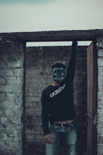 Man Wearing Black Adidas Long Sleeved Shirt And Mask 