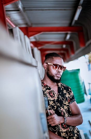 Man Wearing Black and Beige Floral Collared Shirt