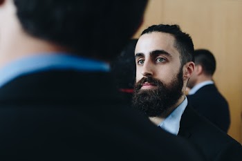 Man Wearing Black and Blue Suit