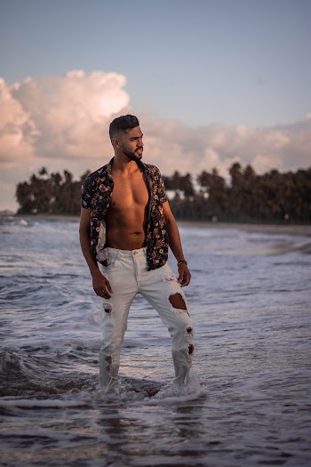 Man Wearing Black and Brown Floral Polo Shirt Standing on Seashore