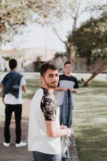 Man Wearing Black and White Crew-neck Shirt Looking Back