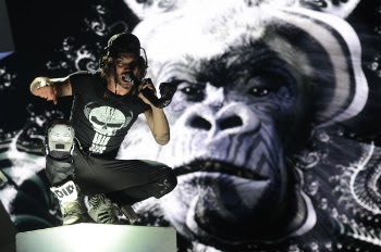 Man Wearing Black and White Skull Print Shirt Singing