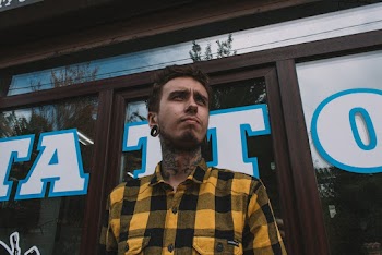 Man Wearing Black and Yellow Plaid Shirt