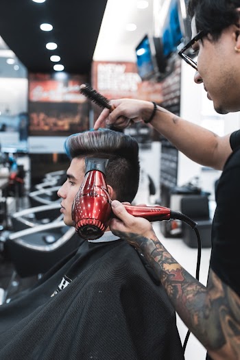 Man Wearing Black Barber Cape