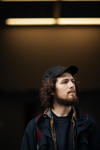 Man Wearing Black Baseball Cap 