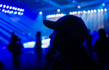 Man Wearing Black Baseball Cap Standing Inside Ring