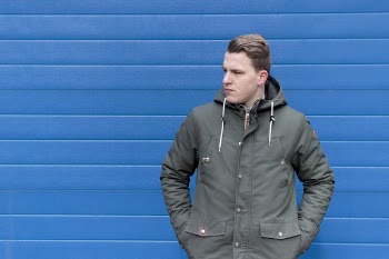 Man Wearing Black Button-up Windbreaker