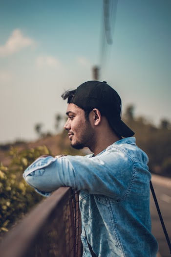 Man Wearing Black Cap Looking Away