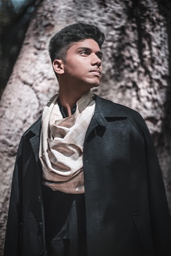 Man Wearing Black Coat Facing Sideways