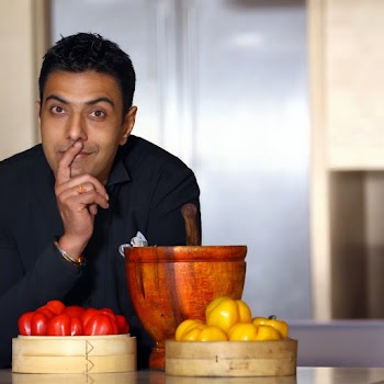 Man Wearing Black Collared Button-up Long-sleeved Shirt Sitting and Putting Right Index Finger Near His Mouth