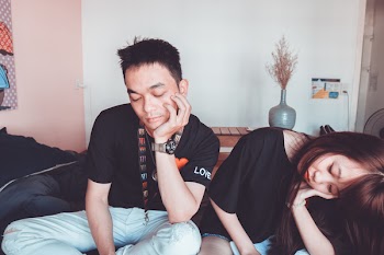 Man Wearing Black Crew-neck Shirt Beside a Woman