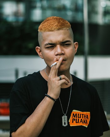 Man Wearing Black Crew-Neck Shirt While Smoking