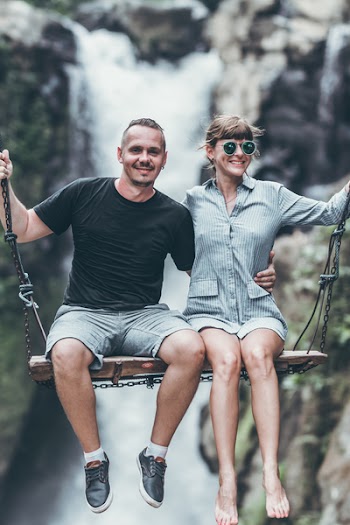 Man Wearing Black Crew-neck Top Riding Swing