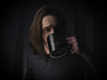 Man Wearing Black Dress Shirt Holding Black Ceramic Mug