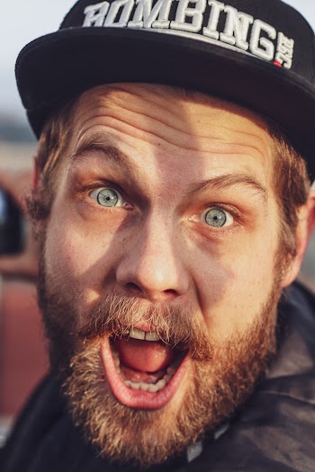 Man Wearing Black Fitted Cap 
