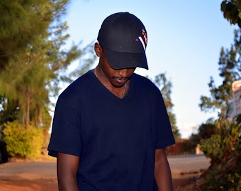 Man Wearing Black Fitted Cap And Black V-neck T-shirt 