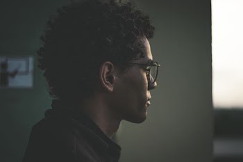 man wearing black framed eyeglasses