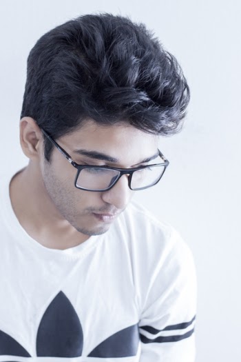 Man Wearing Black Framed Eyeglasses and White and Black Adidas Shirt
