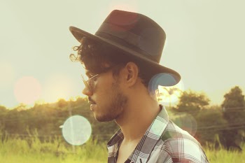 Man Wearing Black Hat and Sunglasses