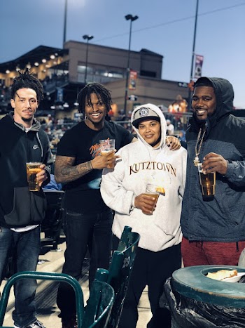 Man Wearing Black Hoodies Holding Beer 