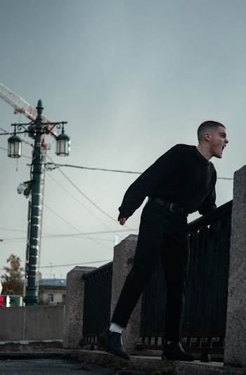 Man Wearing Black Jacket and Black Pants