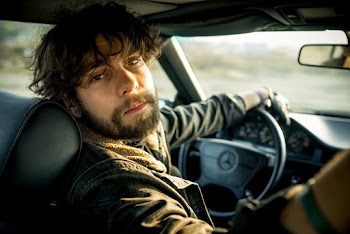 Man Wearing Black Jacket Driving Vehicle