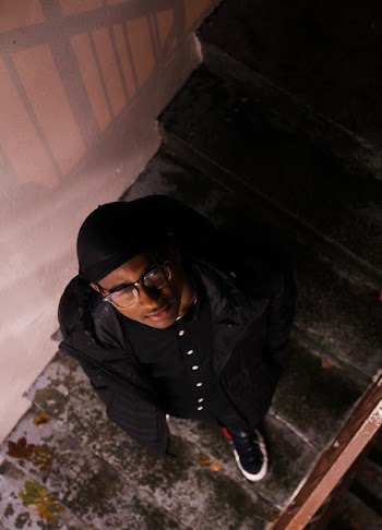 Man Wearing Black Jacket Looking Upward