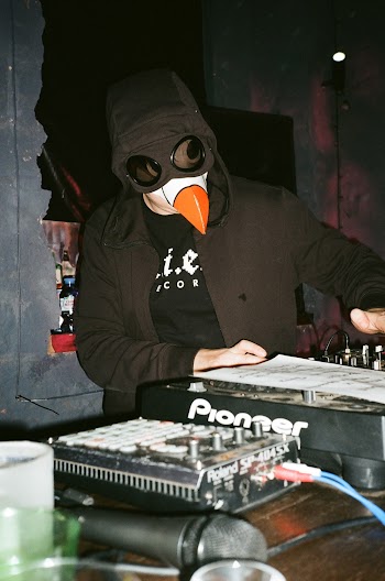 Man Wearing Black Jacket Playing Black Pioneer Turntable
