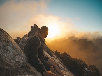 Man Wearing Black Long-sleeved Shirt Standing on Mountain