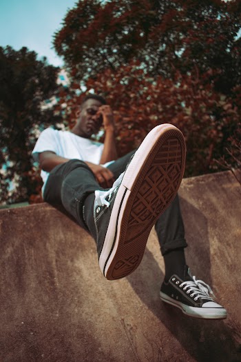 Man Wearing Black Low Top Sneakers