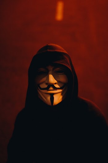 Man Wearing Black Pullover and White and Black Mask