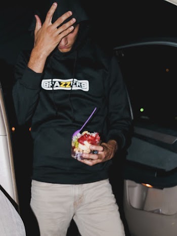 Man Wearing Black Pullover Hoodie Standing Beside Vehicle