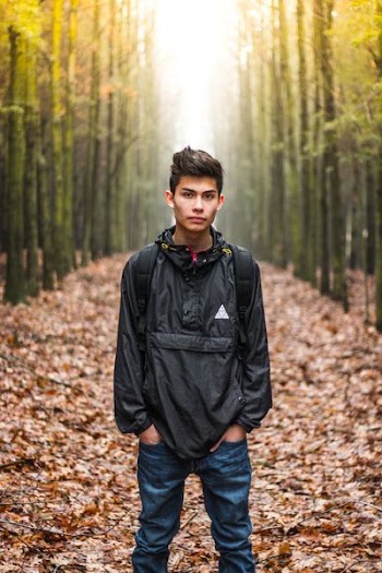 man wearing black quarter-zip windbreaker
