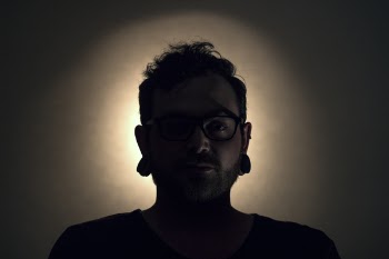 Man Wearing Black Shirt and Black Framed Eyeglasses