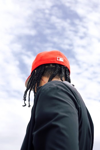 Man Wearing Black Shirt And Red Fitted Cap