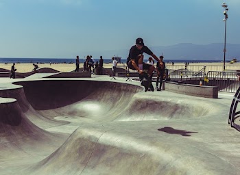 Man Wearing Black Shirt Skateboarding
