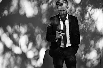 Man Wearing Black Suit Jacket and Pants