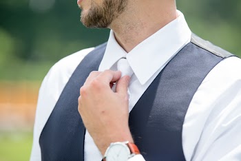 Man Wearing Black Suit Vest And White Tie