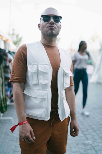 Man Wearing Black Sunglasses and White Vest